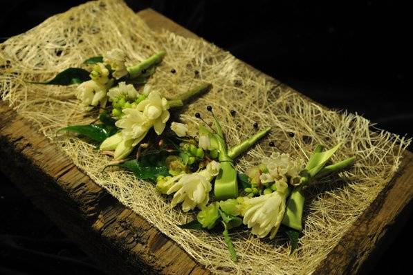 Bitter-sweet smelling tuberose grace the lapel in these boutonnieres.