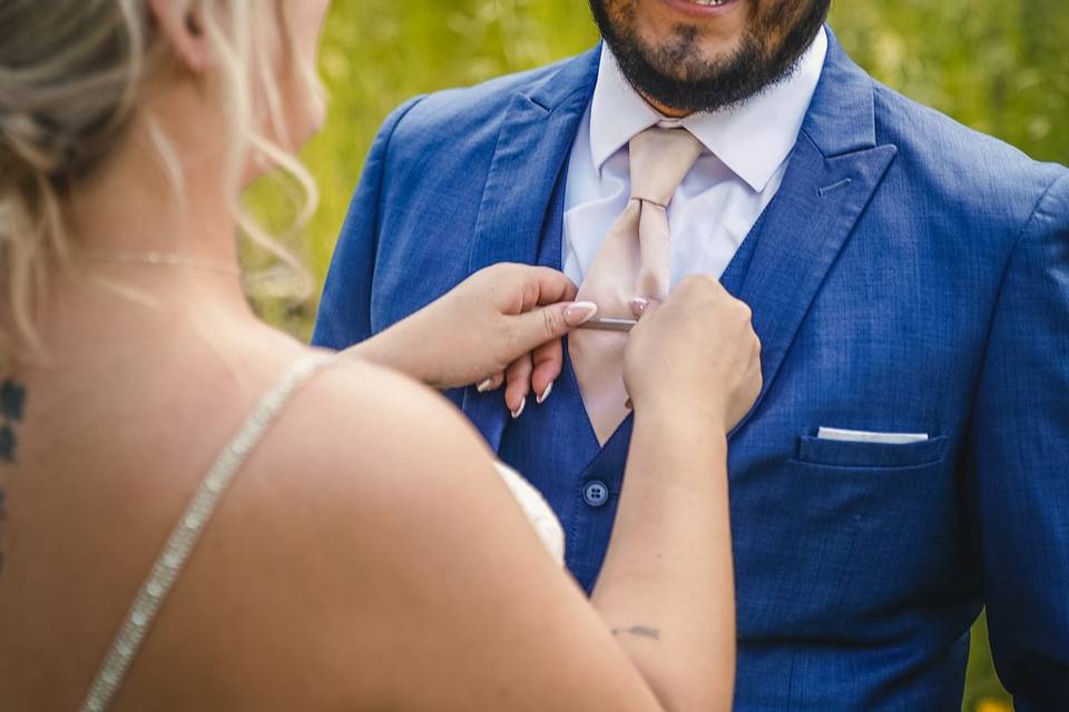 Fixing the groom's tie