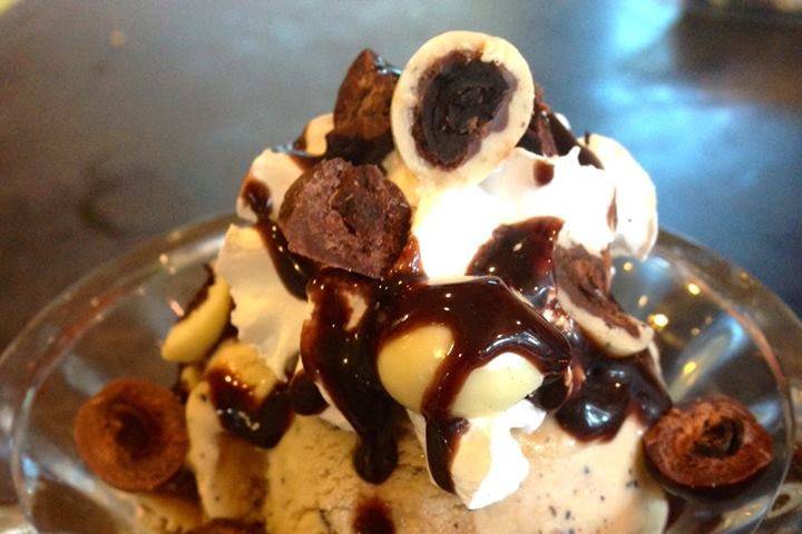 Homemade coffee ice cream with crushed chocolate-covered espresso beans and caramel swirl