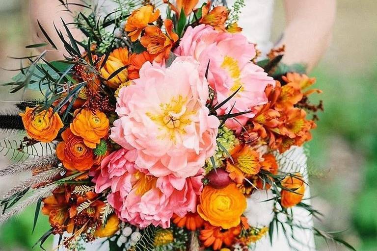 Bouquet with bright orange and pinks