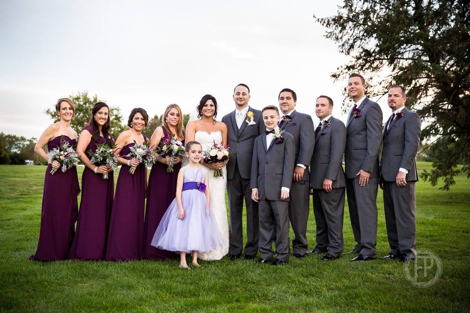 The newlyweds with the wedding attendants