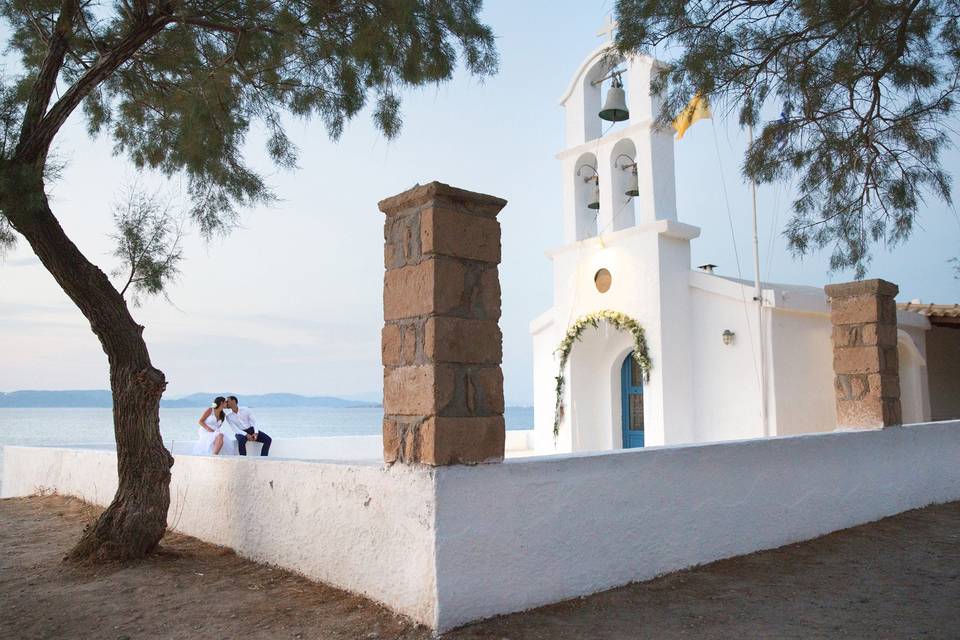 Newlyweds on the wall of a church