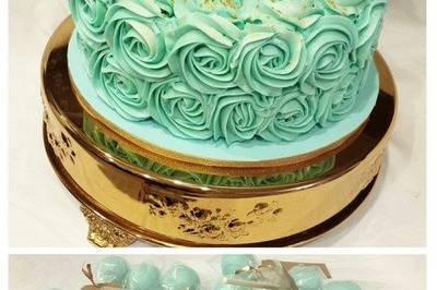 Blue and gold baby shower cake with complimenting cake pops