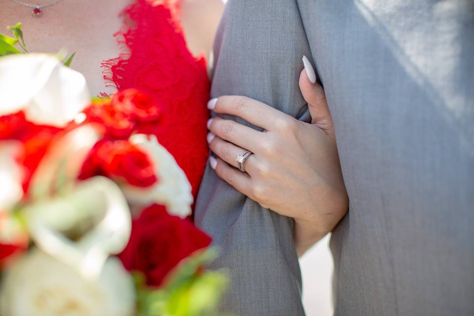 Brides ring on grooms arm