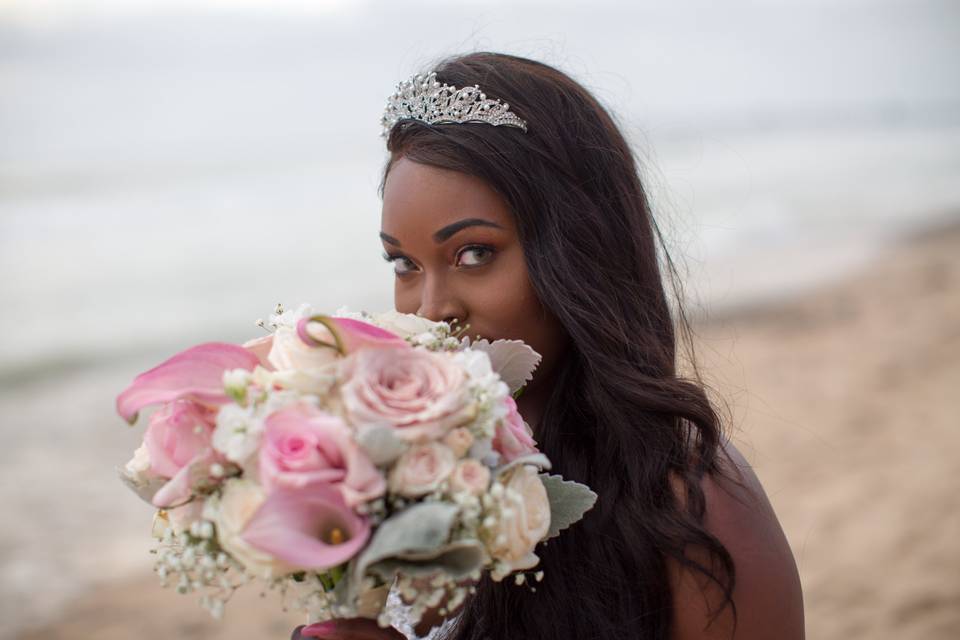 Beautiful bride behind bouquet