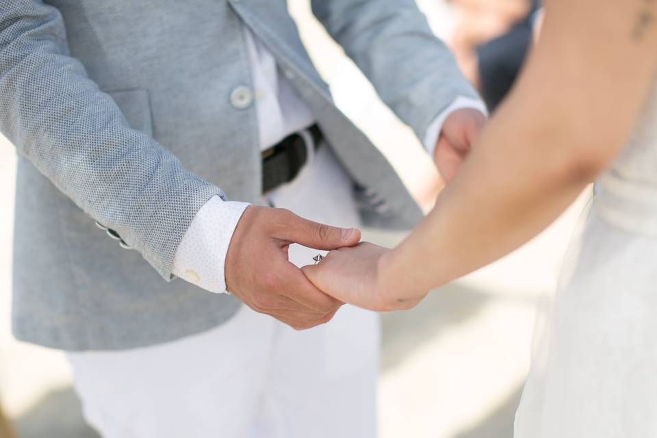 Bride & groom holding hands