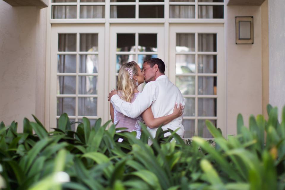 Couple kissing by the window