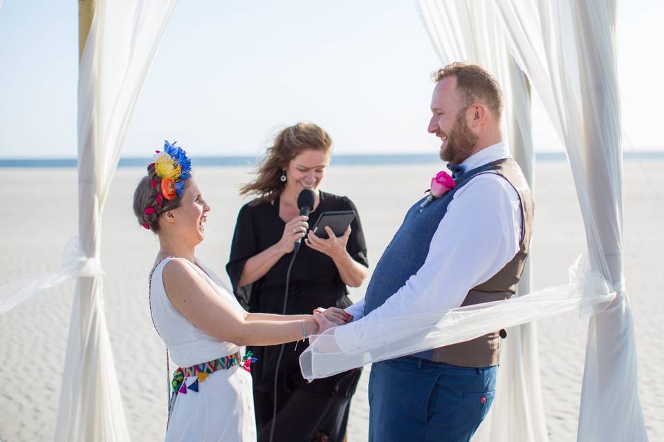 Officiant making couple laugh