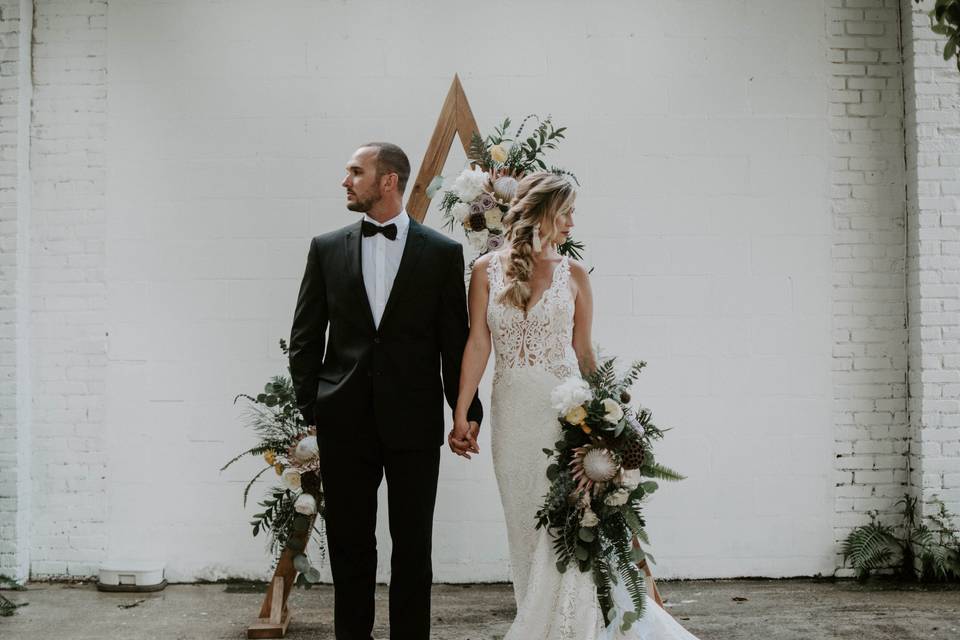 Couple with a fresh arrangement