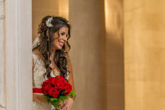 Bride with red bouquet in the San Francisco City Hall