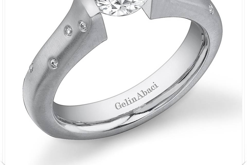 Designer Tension-Set Diamond Engagement Rings and Wedding Bands by GelinAbaci - each one is custom made for The Jewelbox in Ithaca, NY - available in different precious metals, and with a variety of gems.