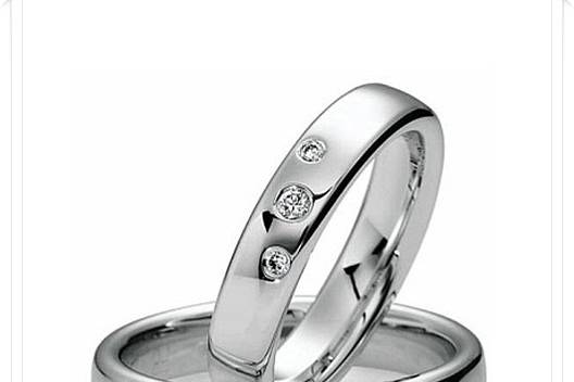 Designer Engagement Rings and Wedding Bands - available in different precious metals with different finishes, and a wide selection of gems from which to choose.