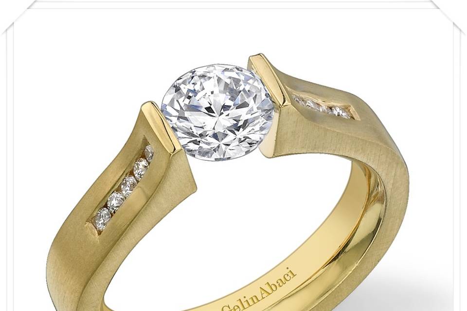 Designer Tension-Set Diamond Engagement Rings and Wedding Bands by GelinAbaci - each one is custom made for The Jewelbox in Ithaca, NY - available in different precious metals, and with a variety of gems.