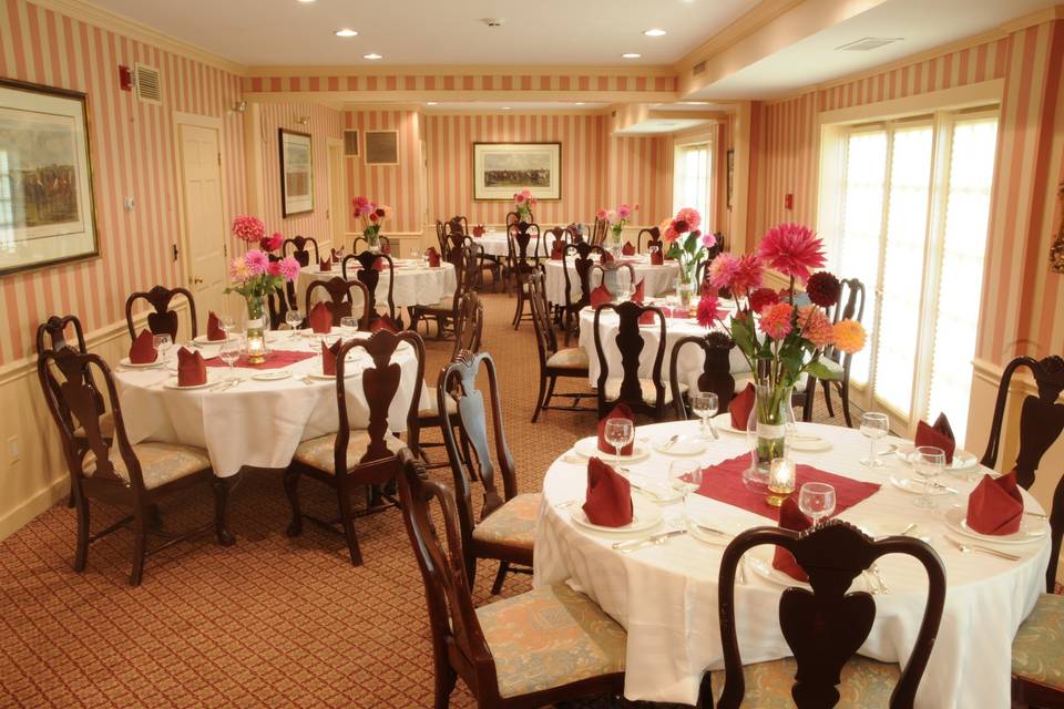 Our main dining room featuring centerpieces with beautiful dahlias that are grown right here on our property.