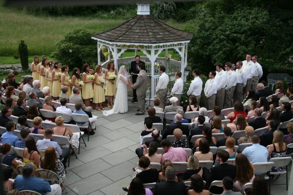 A ceremony of 160 guests at our gazebo with blue stone patio.