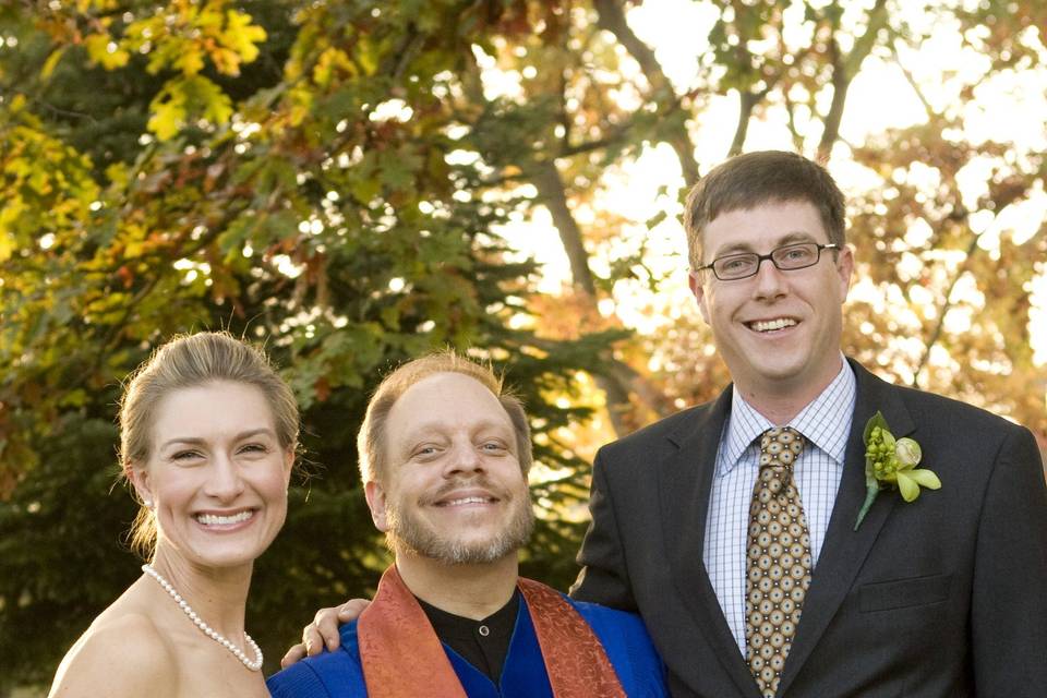 Bride, officiant, and groom