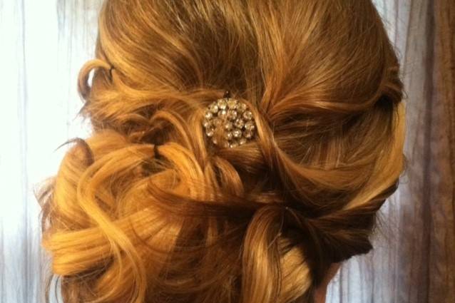 Curled updo with silver accessory
