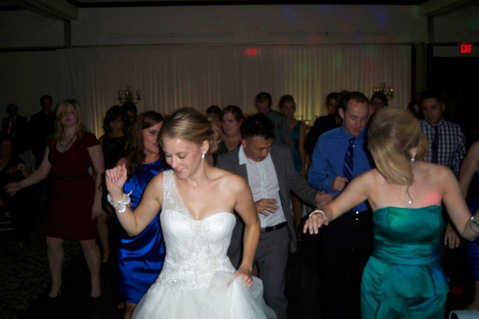 The couple with their guests dancing