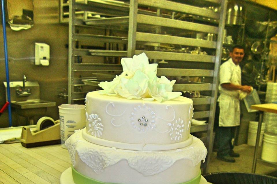 4-tier wedding cake with green details