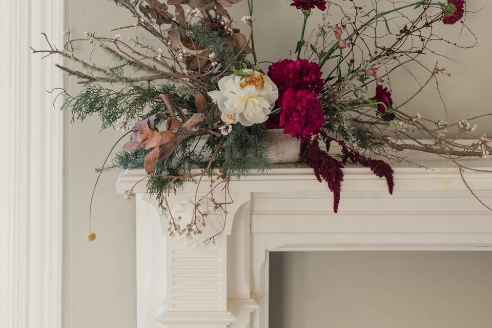 Floral arrangements growing from the mantle