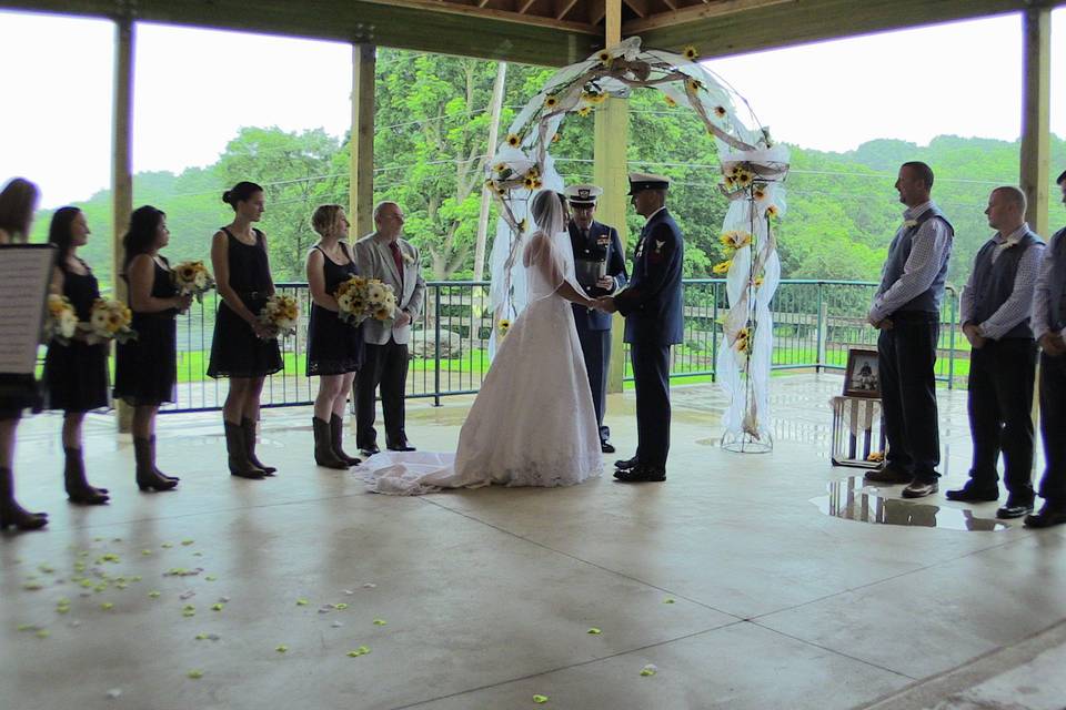 Indoor ceremony with pond in the background