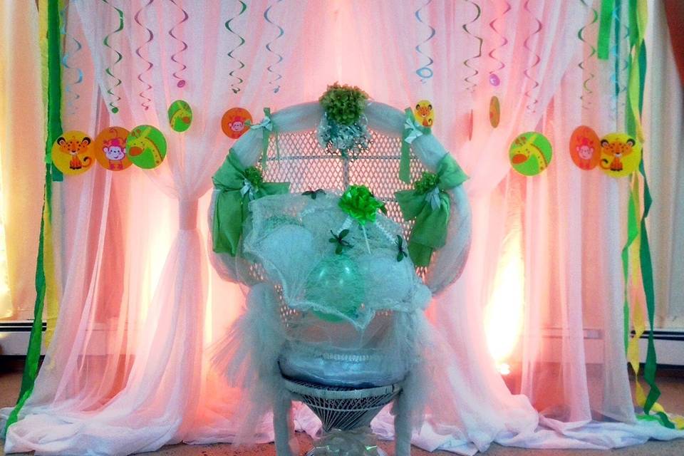 Jungle theme back drop for a baby shower with uplighting! What a difference uplighting makes.