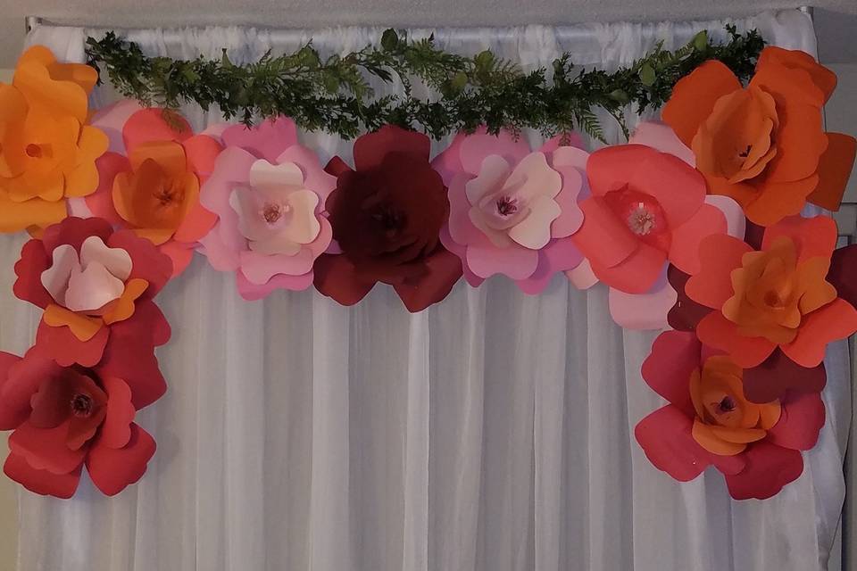 Floral draping for the couples table, head table, treats table, etc.