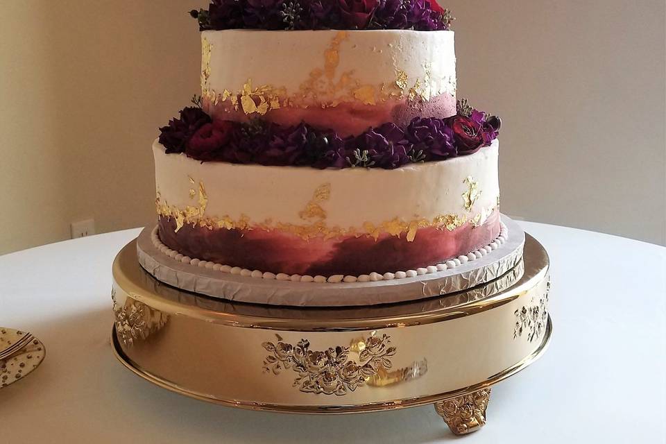 Three tier white and purple cake