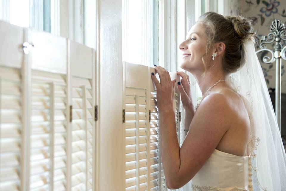 Anxiously peeking bride