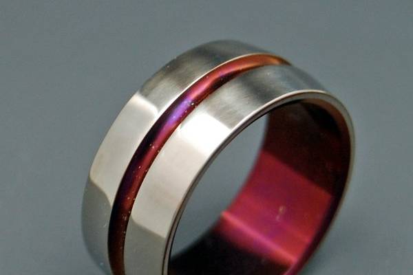 Like all our pieces, this ring was individually crafted out of a single billet of pure Titanium. With one solitary turning running through the middle, this ring is both beautiful and simple. Both the inside of the band as well as the inside of the turning are hand anodized a brilliant wine color.Ask us about engraving and rush orders!_______________________PICK YOUR WIDTH OR ASK US TOOur most commonly requested widths are:3/16” = 4.8mm7/32” = 5.6mm¼” = 6.4mm5/16” = 7.9mm3/8” = 9.5mm½” = 11mmYou can pick your own width or ask us to pick one that is proportional to your size as we are making the ring.