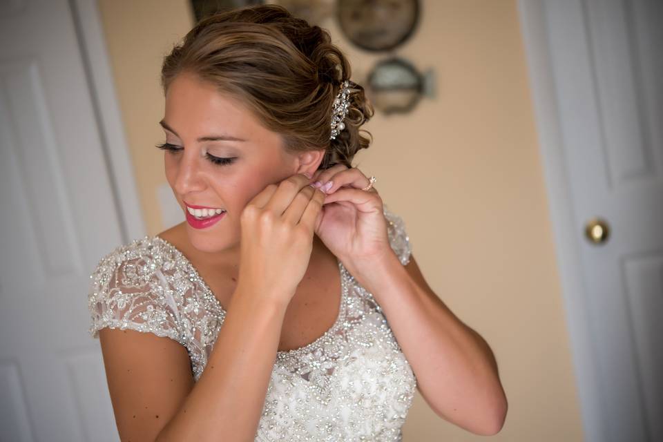 Putting on earrings