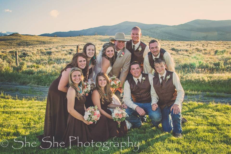 The couple with the bridesmaids and groomsmen