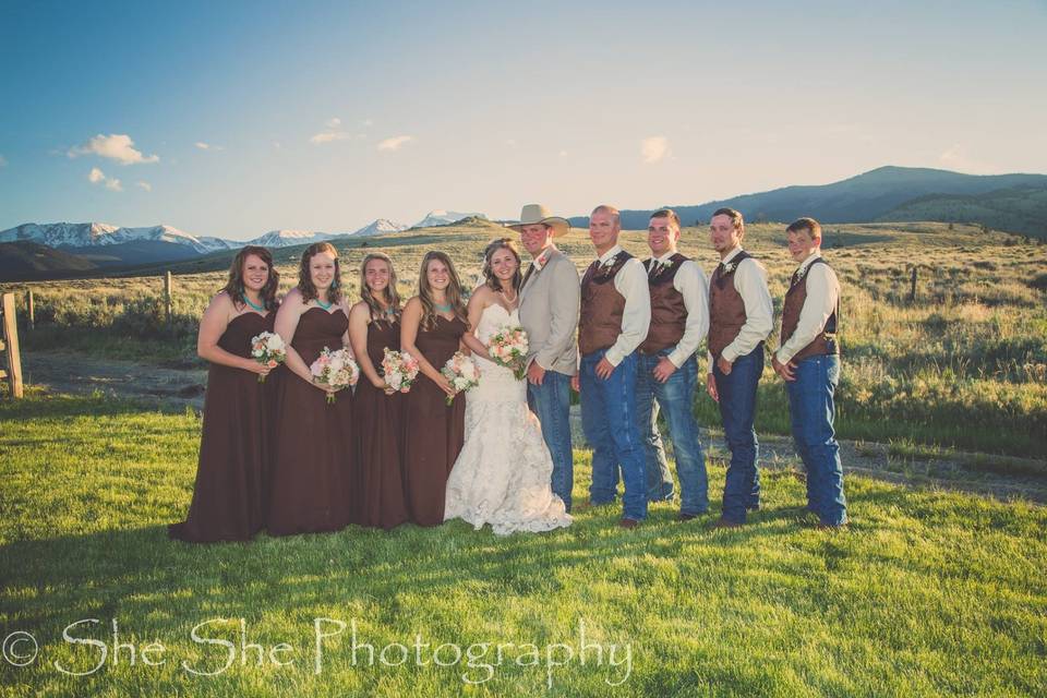 The couple with the bridesmaids and groomsmen