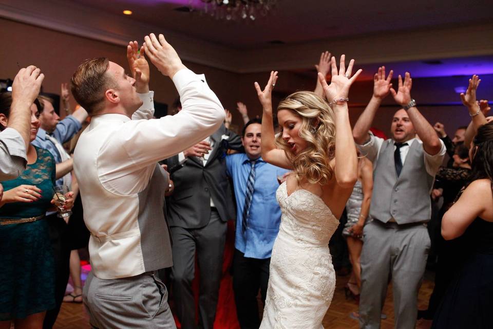 The couple dancing with their guests