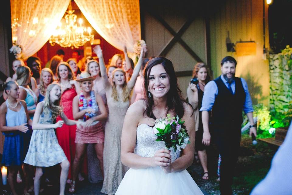 Bride tossing her bouquet