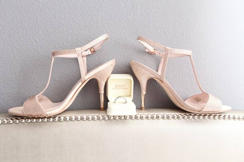 Wedding ring and bride's shoes