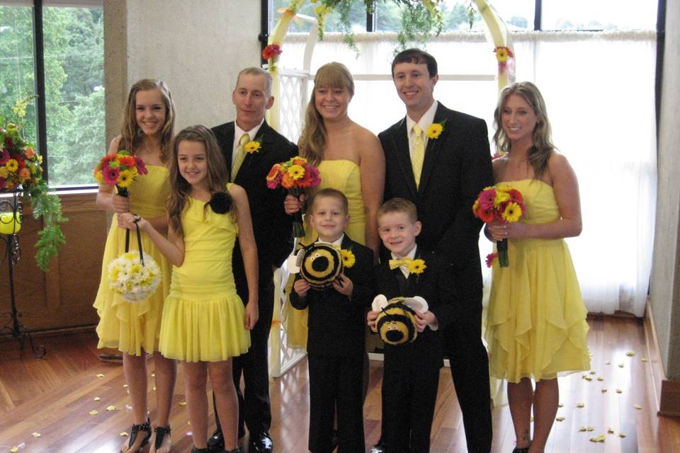 Bridesmaid bouquets with gerbera daisy and roses, and flower girl ball with white and yellow daisy
