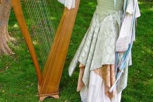 Harpist Stephanie Bennett at a springtime, Fairy-tale themed event.