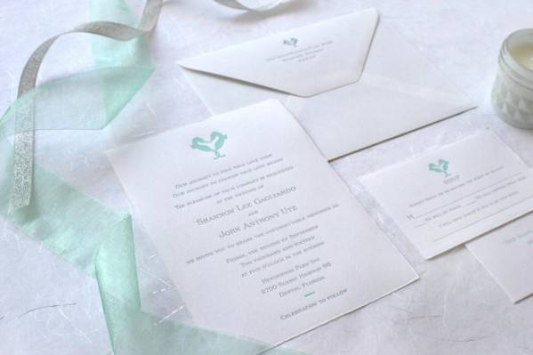 White invitation with a touch of teal