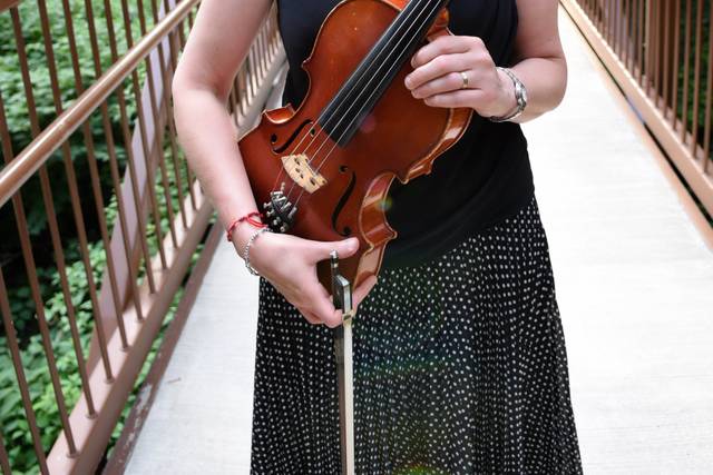 Marcia gets ready to play