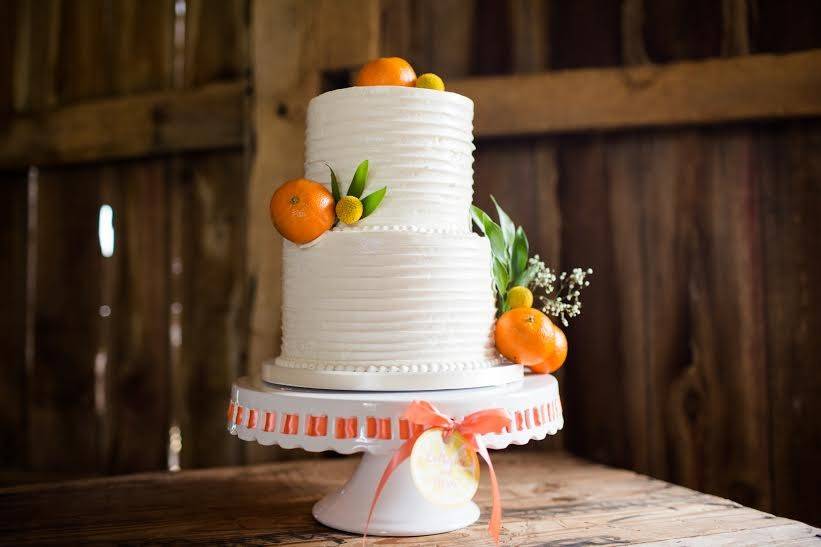 White wedding cake with oranges