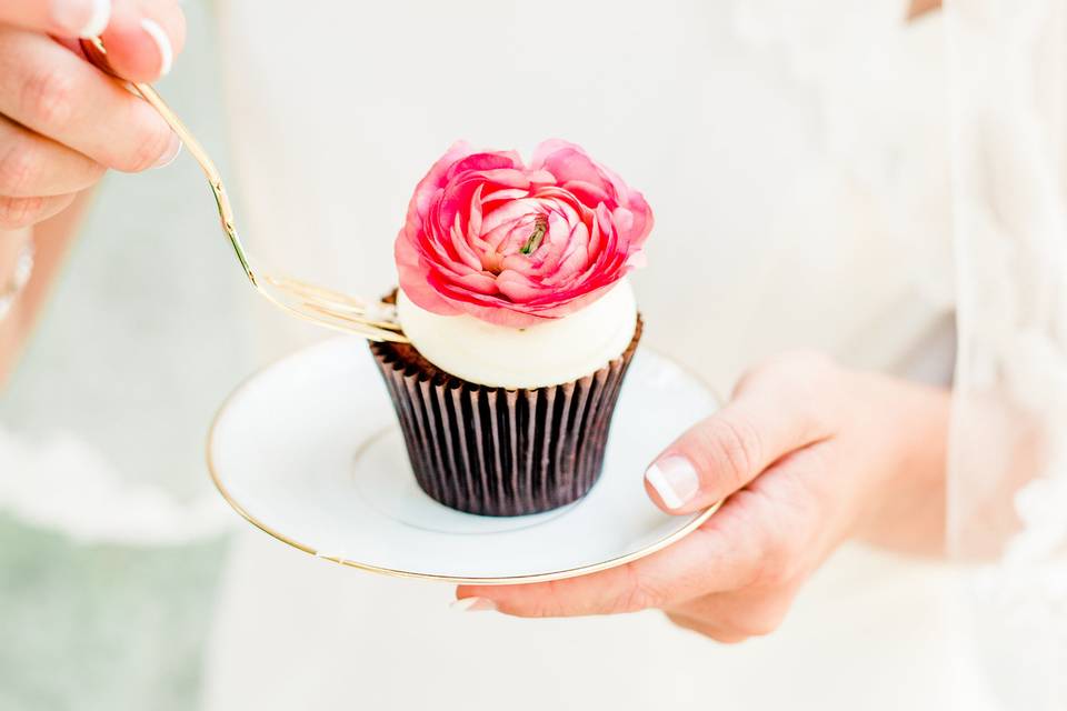 Bride eating a cupcake