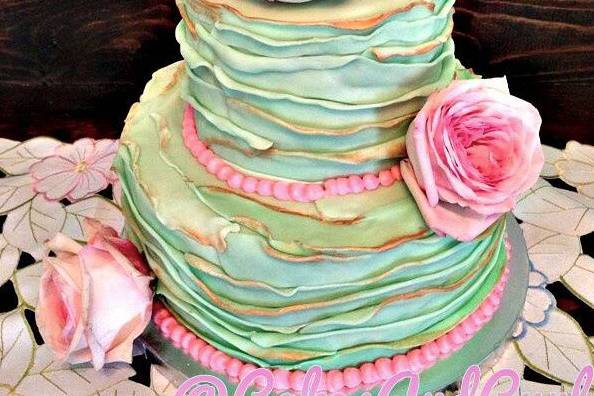 Colorful wedding cake with pink roses