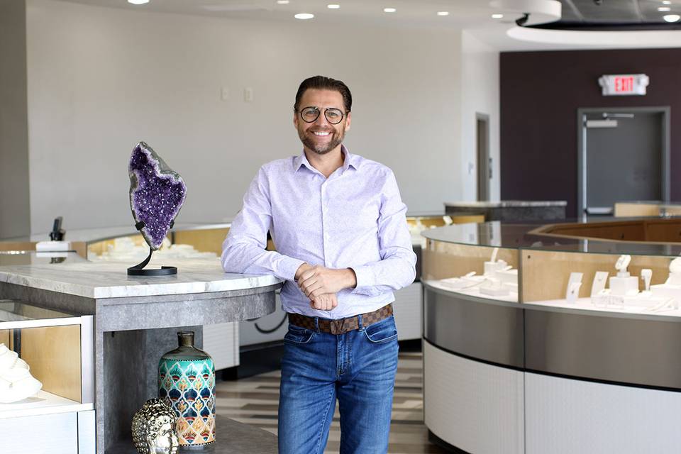 Andy Moquin, owners of Andrews Jewelers standing in his new showroom in Williamsville, NY.