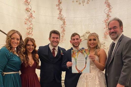 Young Couple holding Ketubah