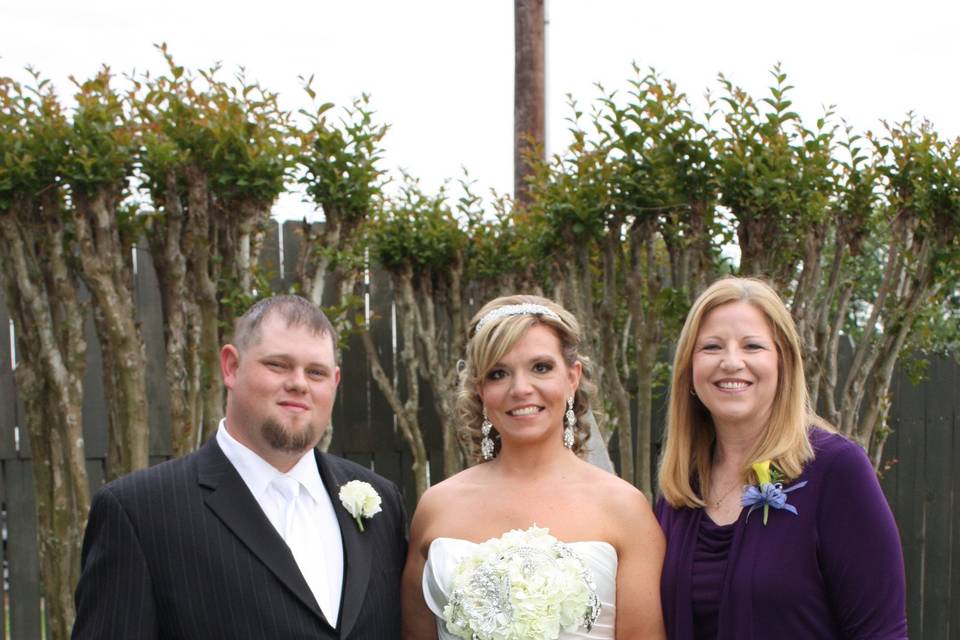 Bride and groom with the officiant