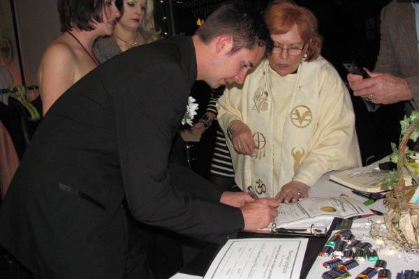 Signing the wedding documents