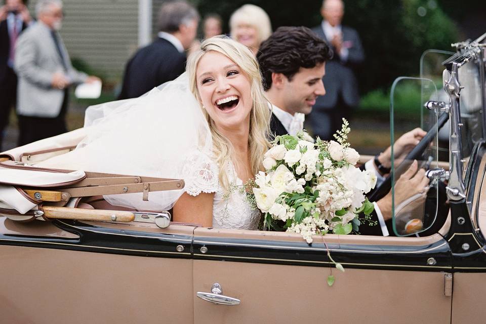 Couple in their wedding car