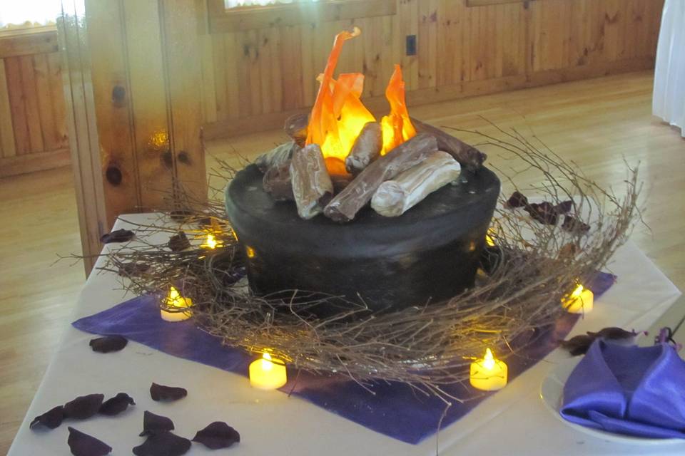 Camping themed wedding.  Cake is completely edible including the flames.  They are made out of pulled sugar.