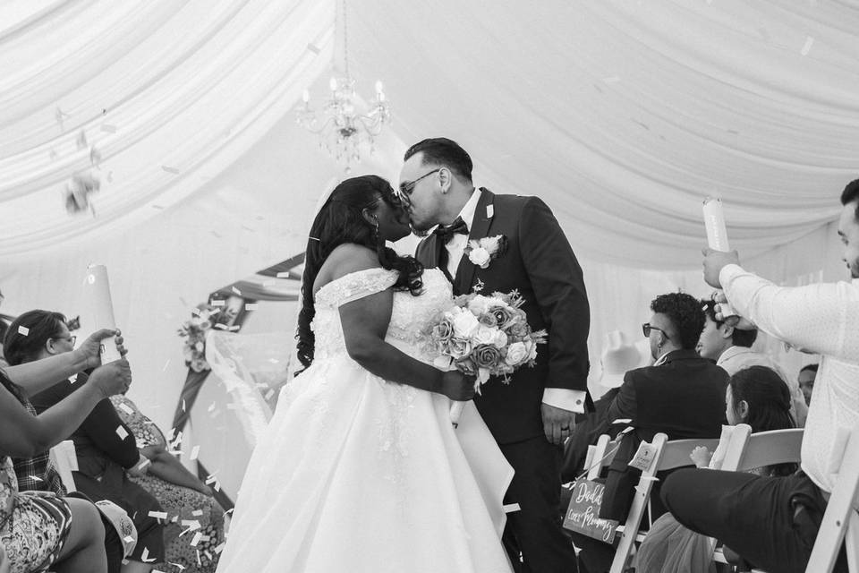 Just Married walking the aisle